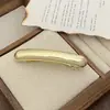 Europa y Estados Unidos transfronterizo nuevo clip brillante de primavera elegante temperamento pasador para coleta alta moda simple accesorios para el cabello al por mayor
