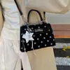Bolso Kelly nuevo y versátil para mujer 2026, lujo ligero, moderno, de nicho, cuadrado pequeño, para ir al trabajo, bolso de mano de lunares