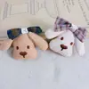 26 Estilos Nuevos de Accesorios para Pasadores de Pelo, Broches, Bolsas, Ropa, Sombreros, Zapatos, Calcetines y Accesorios de Vestimenta con Relleno de Algodón en Forma de Cachorro y Moño