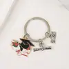 Temporada de formatura chapéu de bacharel tag de flor de livro chaveiro estudante exame de admissão à faculdade presente comemorativo pingente de bolsa criativo