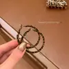 Aretes de Aro Redondos con Estampado de Leopardo en Tela de Aguja Plateada Aretes Retro Europeos y Americanos Y2K Aretes Exagerados de Gama Alta de Nicho