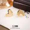Pendientes vintage minimalistas cepillados de doble capa en forma de corazón, clips para orejas de disco de bobina de mosquito de alta gama de nicho europeo y americano, accesorios para orejas dulces y versátiles