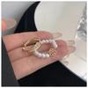 Anillo de flor de perla nuevo de otoño e invierno 2023, estilo moderno y distintivo para mujer, apertura sencilla y ajustable, conjunto distintivo de celebridades de Internet.