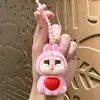 Bolsa de conejo llorando linda amor llavero descompresión colgante de bolsa llavero de coche de pareja colgante pequeño regalo al por mayor