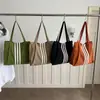 Bolso tote de lona de gran capacidad estilo casual coreano 2026 para mujer, nuevo bolso de mano de moda para estudiantes, adecuado para la escuela y el trabajo
