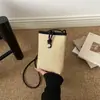 Bolso tejido color block para teléfono para mujer, nueva colección primavera 2026, bolso cuadrado pequeño de paja tejido moderno y a la moda, bolso cruzado simple estilo coreano