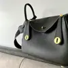 Capa Superior Piel de Vaca Togo Lindy Bolso de Piel Genuina para Mujer 2025 Nuevo Retro Europeo y Americano Bolso Cubo Moda Mano Bolso de Piel Genuina para Mujer