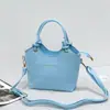 Nuevo bolso tipo cubo de cuero, con una textura suave de cuero PU, versátil bolso cruzado o de hombro, con un asa de cuerda de algodón anudada, un bolso de mano único y elegante para mujer
