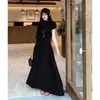 Conjunto casual para mujer, nueva colección de principios de otoño estilo coreano, versátil y favorecedor, con un top de manga corta de cuello medio-alto y una falda larga de cintura alta
