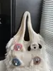 2025 Nuevo Bolso de Mujer Tejido Versátil de Hombro Único de Punto Popular de Comercio Exterior Otoño e Invierno con Bloques de Color Artísticos y Borlas