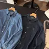 Nueva camisa de mezclilla de manga larga a la moda estilo coreano para mujer 2026, corte holgado, efecto adelgazante, top versátil, prenda exterior casual