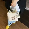 Bolsa de Mão Estilo Coreano Tendência Balde Feminina Nova Coleção Primavera 2025 Estilo Simples Moda Bolsa de Ombro Bolsa Transversal Bolsa Feminina de Alto Padrão