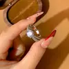 Anel de Comércio Exterior Transfronteiriço com Pedra Grande Nua Totalmente Cravejado de Diamantes Anel de Noivado de Zircônia Anel Clássico de Seis Garras Torcido Rotativo Totalmente Cravejado de Diamantes