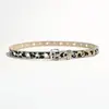 Nuevo cinturón de mujer estilo europeo y americano, cinturón punk Y2K con estampado animal de leopardo para mujer, borde calado con decoración de cuentas y ojales, cinturón de cuero para mujer