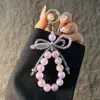 Cadena para teléfono de mariposa de cristal rosa, cordón antipérdida, llavero de alambre de acero de cristal de lujo ligero, exquisito, de alta gama, colgante para bolso