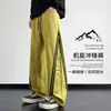 Calça funcional externa da moda estilo americano para homens, nova coleção primavera/outono, casual, corte solto, tamanhos grandes, versátil, calça atlética de perna reta