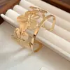Pulsera de malla hueca abierta de moda transfronteriza europea y americana, pulsera de diseño de nicho vintage, joyería de lujo ligero de alta gama para mujer