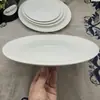 En stock plato blanco puro plato cerámico plano plato redondo plato para bistec comida occidental vajilla para hotel restaurante al por mayor plato para ensalada