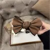 Pinza de clip de lazo satinado tridimensional de doble cara estilo coreano estilo Chanel simple dulce artefacto fijador para coleta alta y moño