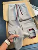 Calça casual jacquard texturizado de cor contrastante com múltiplos bolsos para homens, estilo americano, outono, fina, respirável, reta, solta, perna larga