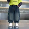 Pantalones de Niña Otoño 2026 Estilo Nuevo Jeans Curvos Estilo Coreano para Niños Pantalones Largos de Otoño de Moda para Niños Tendencia