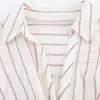 Moda europea y americana transfronteriza AliExpress artículo de venta caliente camisa a rayas de moda con cinturón de empalme