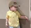 Novo Conjunto de Roupas Infantis Estilo Coreano para Meninos e Meninas, Camiseta Fofa de Manga Curta com Gola Polo e Shorts Listrado Conjunto de Duas Peças
