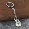 Novo chaveiro pingente de guitarra transfronteiriço, pingente criativo de instrumento musical, liga de zinco DIY decoração para mochila de estudante
