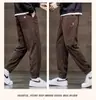 Pantalones jogger de pana forrados y engrosados de venta caliente transfronterizos para hombre, pantalones holgados y versátiles, pantalones cálidos de marca de moda para otoño e invierno