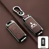 Adequado para novo conjunto de chaves Mitsubishi Outlander Jinxuan ASX Yi Ge Yi Shen Guang carro Pajero Jin Chang fivela de concha