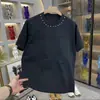 Nueva Camiseta de Manga Corta Suelta con Cuello Redondo y Estampado de Remaches de Acero para Hombre Moda de Primavera Versátil Casual Ropa de Calidad de Moda
