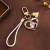 Presente de Dia dos Namorados chaveiro pingente coração de cristal pulseira de celular fofa decoração de bolsa coração acessório criativo