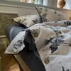 Juego de cuatro piezas de gasa de doble capa estilo botón grado A, funda nórdica y funda de almohada de algodón puro, adecuado para dormitorios de estudiantes, juego de cama de tres piezas