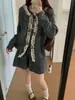 Conjunto de punto suave estilo coreano 2026 otoño e invierno nuevo cárdigan suéter con cordones + falda de cintura alta conjunto de dos piezas para mujer