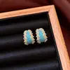 Pendientes de borla con flor de trébol de circonita vintage con un toque de alta gama, pendientes versátiles y de moda al por mayor