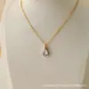 Luz colgante con colgante de circonita en forma de gota de agua transfronteriza europea y americana, collar de acero de titanio de lujo para mujer, cadena para el cuello de nicho de alta gama, todo a juego, de moda para el trabajo