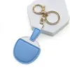 Colgante para Bolsa de Raqueta de Tenis de Mesa Deportiva Transfronteriza Colgante de PU Creativo Lindo Pequeño Regalo Decoración de Mochila Llavero de Coche