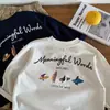 Ropa coreana para bebés y niños 2026 primavera y otoño nuevo estilo camiseta versátil y elegante para niños camiseta básica de algodón puro con estampado de letras