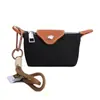 Mini Bolsa de Nylon para Empanadas 2026 Nuevo Modelo Bolsa para Audífonos Bloques de Color Compacta para Monedas y Llaves Bolso Cuadrado Pequeño de Moda