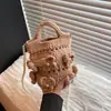 Estilo casual de moda transfronterizo bolsa tejida de nicho para mujer nueva 2026 bolsa de vacaciones en la playa bolso de hombro único texturizado