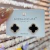 Pendientes de moda coreana con microincrustaciones de flor de cuatro hojas de alta gama, lujo ligero, combinables, con pasador de plata, pendientes de moda nuevos 2025
