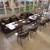 Juego de muebles de cafetería estilo retro, que incluye mesas, sillas y sofás, adecuado para tiendas de té de leche, bares, hoteles y áreas de recepción; asientos de cabina modernos de mediados de siglo