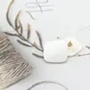 Suministro directo de fábrica botón de resina de dos ojales Triángulo Cuadrado forma de concha imitación hebilla para abrigo de mujer cortavientos abrigo de cuero en stock
