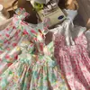 2026 Verano Nuevo Estilo Coreano Colorido Estampado Floral Vestido para Niñas Vacaciones Vestido de Tirantes con Mangas Acampanadas Ropa Infantil