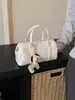 Bolso Cruzado de Hombro Único Modelo Nuevo 2026 para Mujer para el Trabajo y los Viajes Diarios, de Gama Alta, Color Sólido con Colgante Lindo, Bolso de Moda y Versátil
