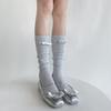 Calcetines de felpa brillantes de seda brillante vertical de pasarela de primavera y verano para mujer, plateados, de cuero, con lazo, estilo miu, versátiles, hasta la pantorrilla