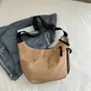 2024 Nova Moda Casual Deslocamento Grande Capacidade Leve Esportes Nylon Lona Personalizado Crossbody Dumpling Bolsa de Ombro