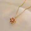 Collar para Mujer Moda Nicho Nuevo Diseño Colgante Celebridad de Internet Flor de Zircón Bauhinia Giratoria Temperamento Collar de Acero Titanio