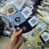 Calcetines de algodón gruesos de punto para bebé, otoño e invierno, altos, holgados, a rayas, con letras de dibujos animados, calcetines para niños, venta al por mayor, envío completo