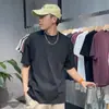 Camiseta masculina de alta qualidade, design desconstruído com corte tridimensional minimalista, manga curta, modelagem solta estilo americano, tendência de verão.